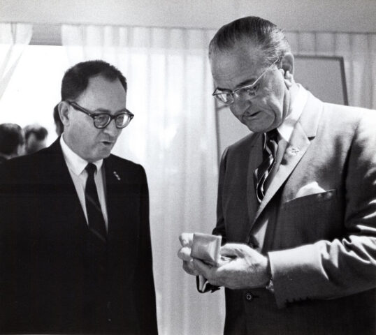 Amb Crockett presents a gift of cufflinks to President Johnson at Las Mercedes airport, 8 July 1968. Credit LBJ Library Yoichi Okamoto