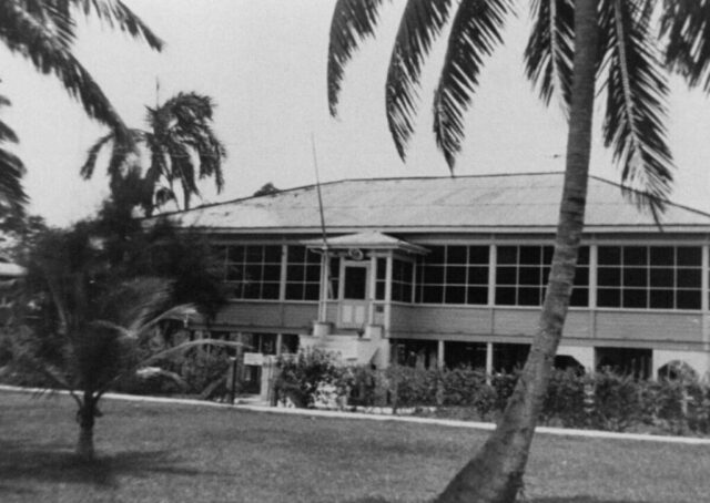 A two story building in a tropical setting that served as the US Consulate (residence and office) in Puerto Cortes, Honduras, 1946. ©KMC