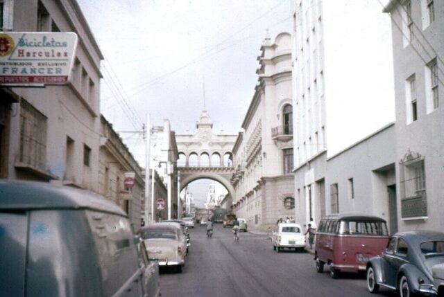 A picturesque downtown area with an archway over a main street, Guatemala City, Guatemala, 1960. ©KMC
