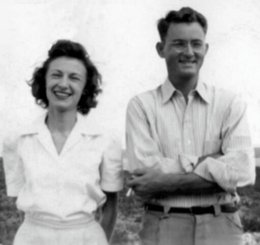 A young couple stand smiling in Laredo. Texas, c 1943. ©KMC