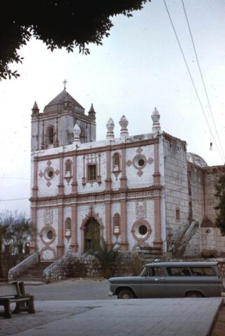 The ancient white and salmon colored Misión de San Ignacio de Kadakaamán, Baja California Sur, 1961. ©KMC
