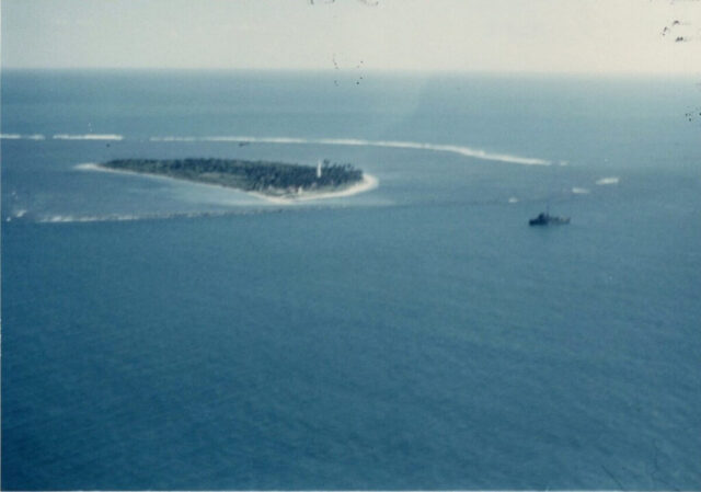 A key and a Mexican military boat in blue water off Mexico’s Gulf Coast are seen from the air, 1952. ©KMC