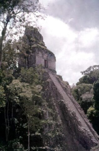 A crumbling Maya temple in the heart of the jungle. Tikal, Petén Department, Guatemala, 1959. ©KMC
