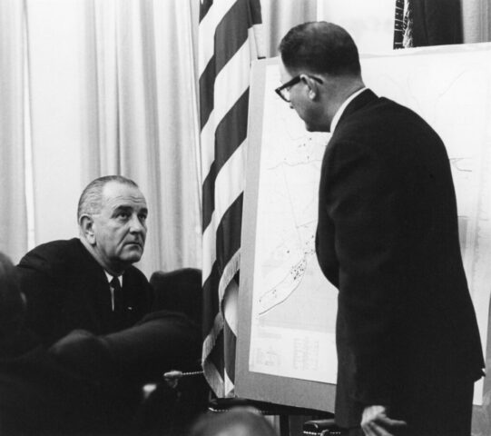 Kennedy M Crockett briefing President Lyndon B Johnson on disposition of US troops in Santo Domingo, Dominican Republic, 14 May 1965. LBJ Library Yoichi Okamoto
