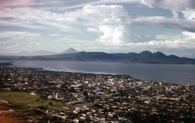 Managua on Lago Xolotlán (Lake Managua) with Chiltepe Peninsula and Volcán Momotombo in the background, 1958. ©KMC