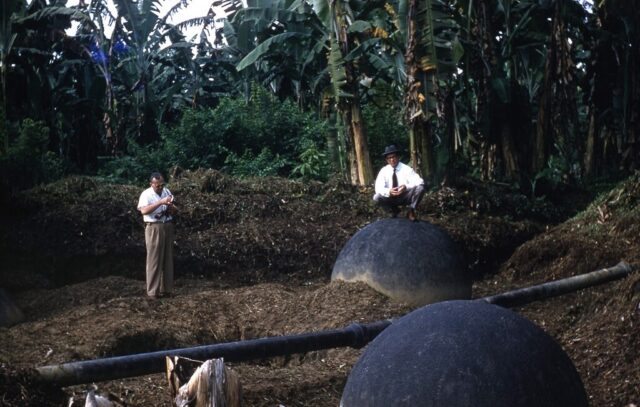 Senator Ellender on stone sphere uncovered by the United Fruit Company in Costa Rica, 1958. ©KMC