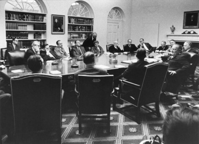 President Johnson briefing congressional leadership on the administration's strategy in the Dominican Republic. KMC in left background. 28 April 1965. LBJ Library Okamoto