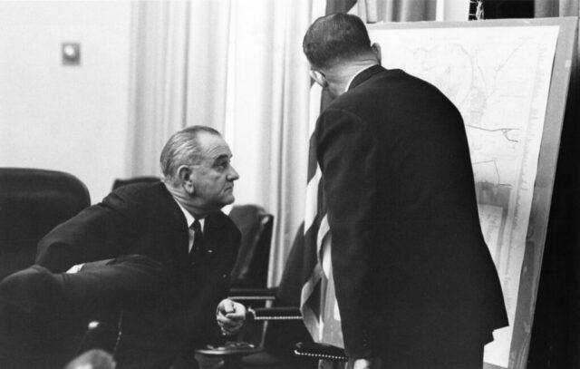 Kennedy M Crockett briefing President Lyndon B Johnson on disposition of US troops in Santo Domnigo, Dominican Republic, 14 May 1965. LBJ Library Yoichi Okamoto